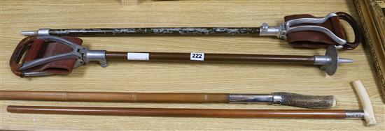 Four assorted walking sticks longest 107cm